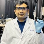 Dr Yasir Siddique with efficiency record holder solution based CISSe solar cell at his lab in KIER. PHOTO: EXPRESS